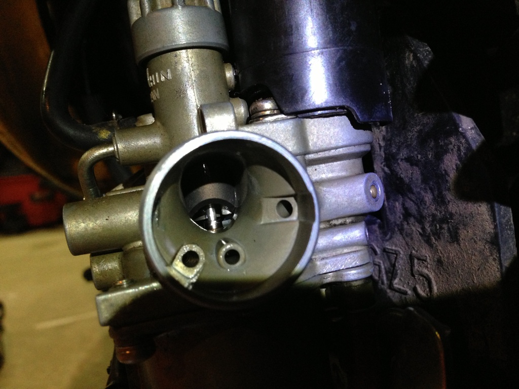 Throttle cable sticks down into carb with the free play in the throttle grip.